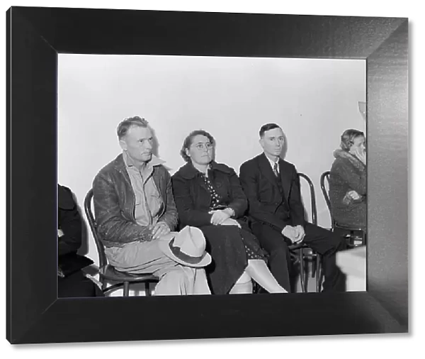 Night meeting in the FSA office, Tulare County, California, 1938. Creator: Dorothea Lange