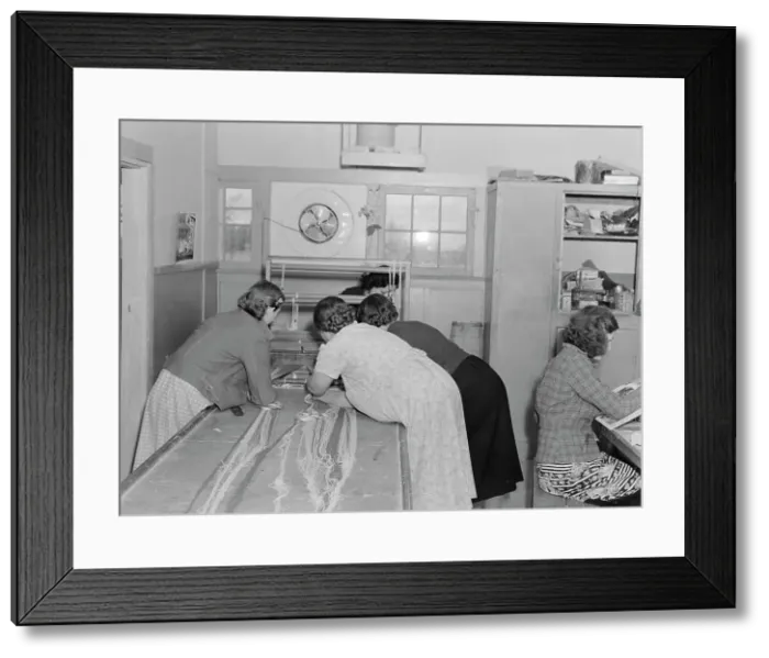 Framed Print : In the sewing room, Shafter camp for migrants (FSA), California, 1938. Creator: Dorothea Lange Framed Print : In the sewing room, Shafter camp for migrants (FSA), California, 1938. Creator: Dorothea Lange