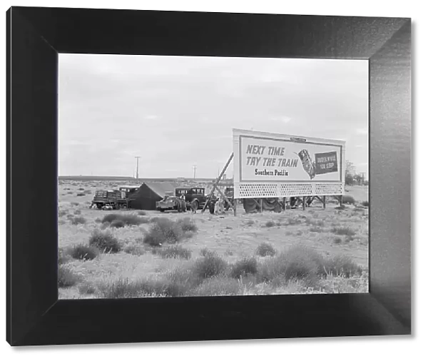 Billboard along U.S. 99...three destitute families...Kern County, CA, 1938. Creator: Dorothea Lange