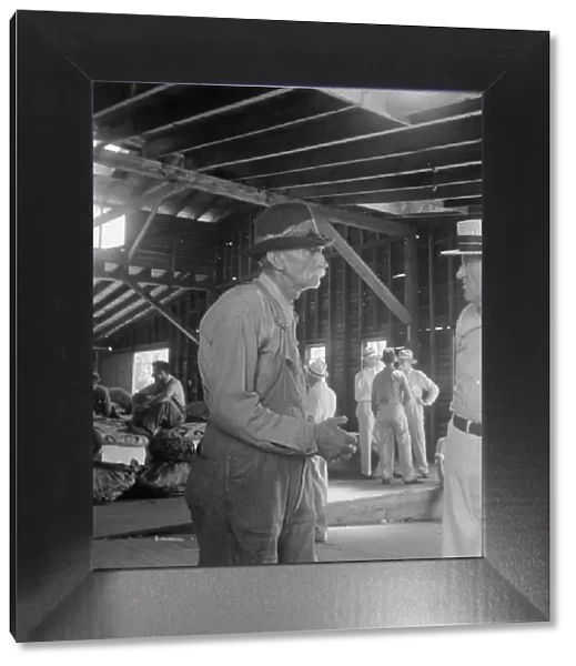 Each farmer follows his tobacco in the warehouse to learn what price... Douglas, Georgia, 1938. Creator: Dorothea Lange