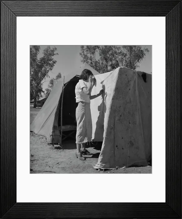 Framed Print : Woman in a California pea pickers camp, mending the tent, 1937. Creator: Dorothea Lange Framed Print : Woman in a California pea pickers camp, mending the tent, 1937. Creator: Dorothea Lange