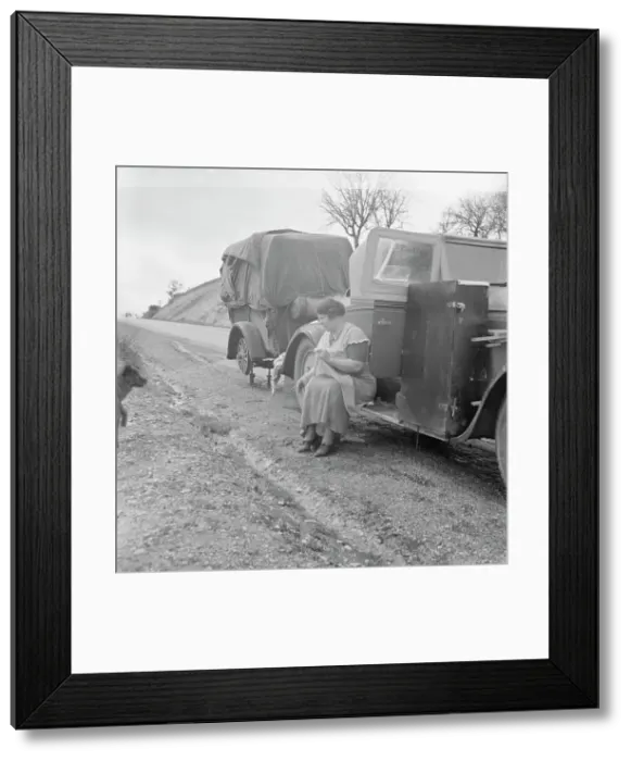 Framed Print : Migrant pea workers on the road, all their worldly possessions in car and trailer, California, 1936. Creator: Dorothea Lange