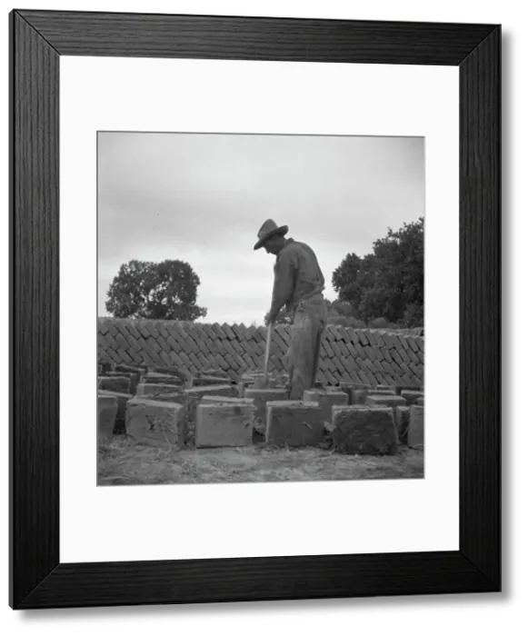 Framed Print : Bosque Farms project - making adobe brick for school and permanent houses, New Mexico, 1935. Creator: Dorothea Lange Framed Print : Bosque Farms project - making adobe brick for school and permanent houses, New Mexico, 1935. Creator: Dorothea Lange