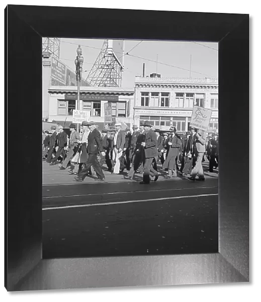 Mass meeting of WPA workers parading up Market Street, San Francisco, California, 1939. Creator: Dorothea Lange