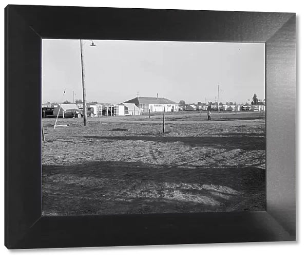 Migratory labor camp during pea harvest, FSA, Brawley, Imperial Valley, California, 1939. Creator: Dorothea Lange