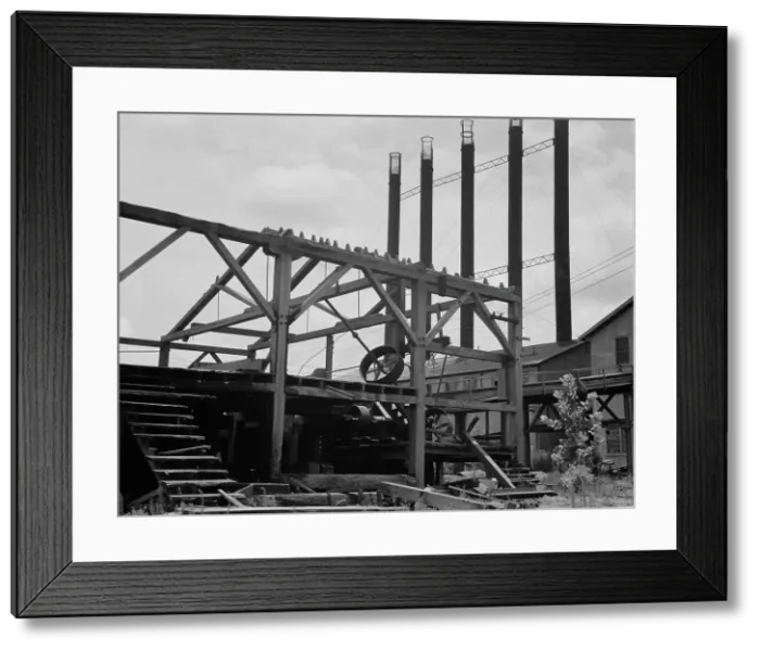 Framed Print : Lumber mill being dismantled at Careyville, Florida, 1937. Creator: Dorothea Lange