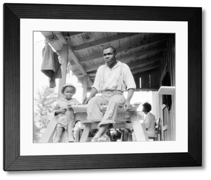 Framed Print : Evicted Arkansas sharecropper, now building his new home at Hill House, Mississippi, 1936. Creator: Dorothea Lange Framed Print : Evicted Arkansas sharecropper, now building his new home at Hill House, Mississippi, 1936. Creator: Dorothea Lange