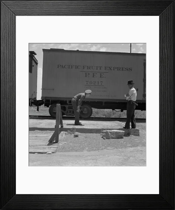 Framed Print : Inspecting a freight train from Mexico for smuggled immigrants, El Paso, Texas, 1938. Creator: Dorothea Lange Framed Print : Inspecting a freight train from Mexico for smuggled immigrants, El Paso, Texas, 1938. Creator: Dorothea Lange