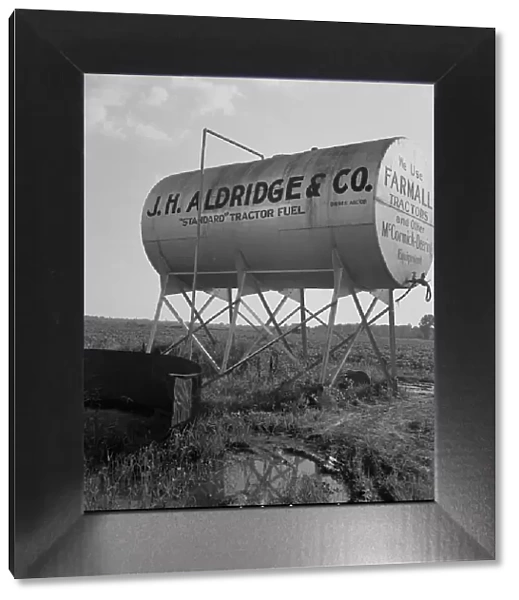 Fuel tank on the Aldridge Plantation, Mississippi, 1937. Creator: Dorothea Lange