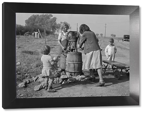 Water supply, American River camp, California, San Joaquin Valley, CA, 1936. Creator: Dorothea Lange