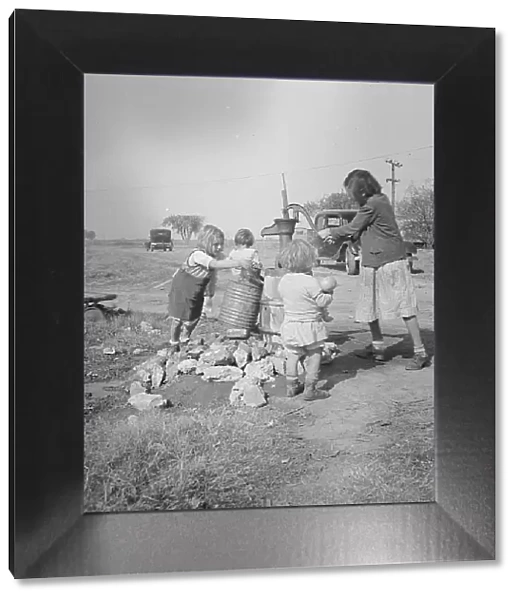Water supply, Migratory camp for cotton pickers, San Joaquin Valley, California, 1936. Creator: Dorothea Lange