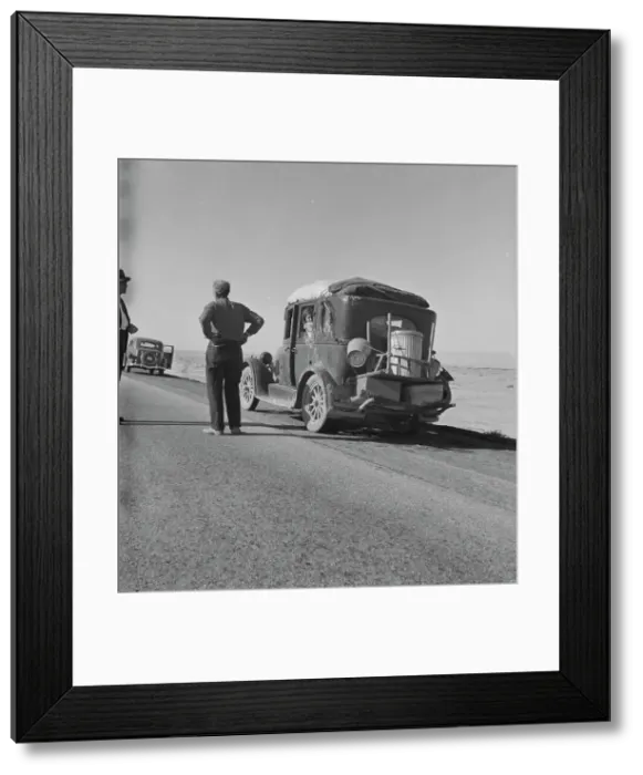 Framed Print : Migrant from Chickasaw, Oklahoma, stalled on the desert in southern California with no money, 1937. Creator: Dorothea Lange Framed Print : Migrant from Chickasaw, Oklahoma, stalled on the desert in southern California with no money, 1937. Creator: Dorothea Lange