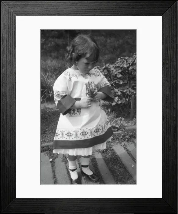 Framed Print : Unidentified child, standing outdoors, between 1911 and 1942. Creator: Arnold Genthe Framed Print : Unidentified child, standing outdoors, between 1911 and 1942. Creator: Arnold Genthe