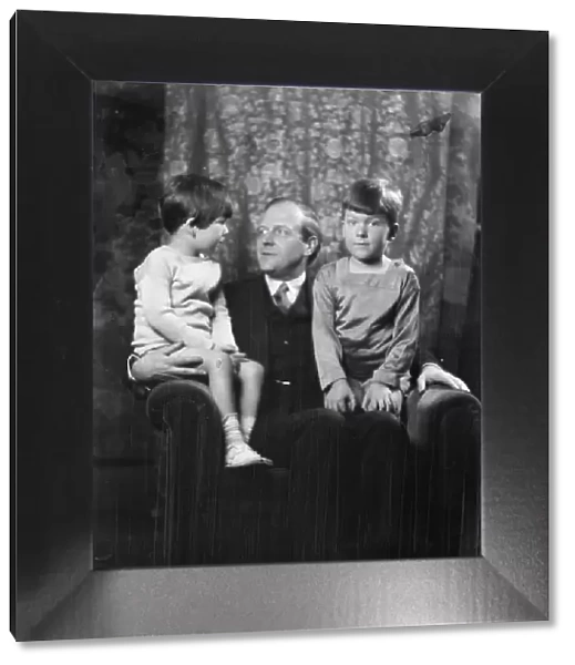 Unidentified man and two children, portrait photograph, between 1911 and 1942. Creator: Arnold Genthe