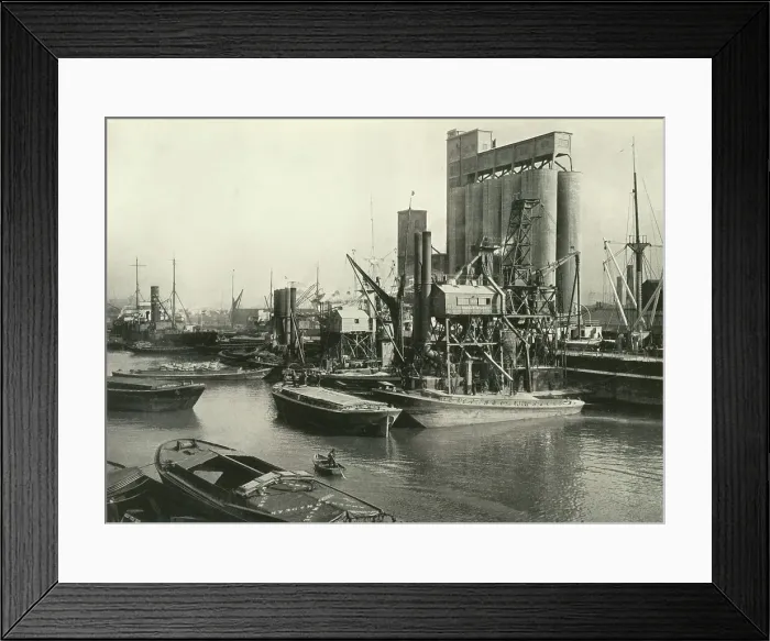Framed Print : Factories, Refineries, Granaries Grow Thick Ship Discharging Grain by Floating Pneumatic... 1937 Creator: J Dixon-Scott. Factories, Refineries, Granaries Grow Thick Ship Discharging Grain by Floating Pneumatic Framed Print : Factories, Refineries, Granaries Grow Thick Ship Discharging Grain by Floating Pneumatic... 1937 Creator: J Dixon-Scott. Factories, Refineries, Granaries Grow Thick Ship Discharging Grain by Floating Pneumatic