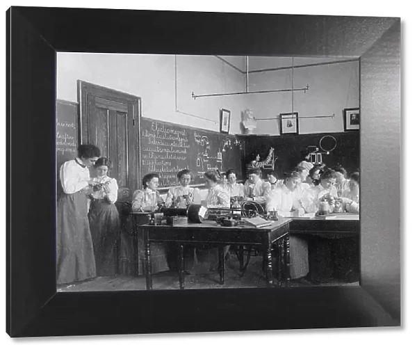 Group of young women studying electro-magnets in normal school, Washington, D.C. (1899?). Creator: Frances Benjamin Johnston