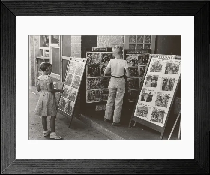 Framed Print : Children looking at posters in front of movie, Saturday, Steele, Missouri, 1938-08. Creator: Russell Lee Framed Print : Children looking at posters in front of movie, Saturday, Steele, Missouri, 1938-08. Creator: Russell Lee