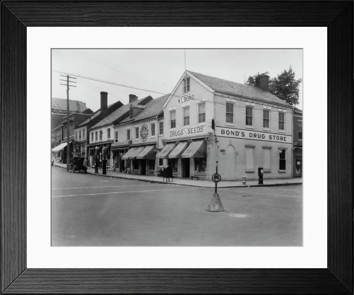 Framed Print : Brick Row, Commerce and Main Streets, located in the vicinity of Fredericksburg...Virginia, c1925. Creator: Frances Benjamin Johnston Framed Print : Brick Row, Commerce and Main Streets, located in the vicinity of Fredericksburg...Virginia, c1925. Creator: Frances Benjamin Johnston