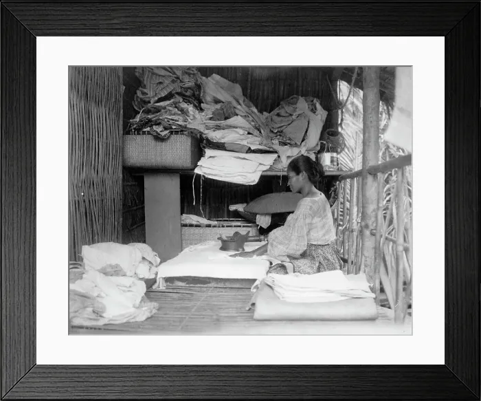 Framed Print : Javanese(?) woman sitting in room working with textiles at exhibit featuring foreign... 1892. Creator: Frances Benjamin Johnston Framed Print : Javanese(?) woman sitting in room working with textiles at exhibit featuring foreign... 1892. Creator: Frances Benjamin Johnston