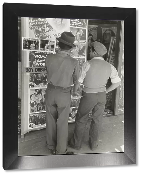 Mexican boys looking at movie poster, San Antonio, Texas, 1939-03. Creator: Russell Lee
