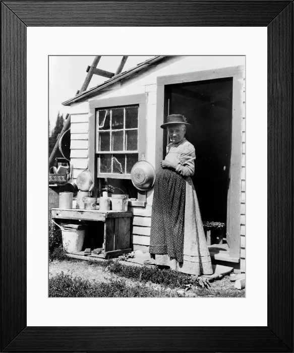 Framed Print : Elderly woman, standing at doorway, on Mackinac Island, Michigan, 1903. Creator: Frances Benjamin Johnston Framed Print : Elderly woman, standing at doorway, on Mackinac Island, Michigan, 1903. Creator: Frances Benjamin Johnston