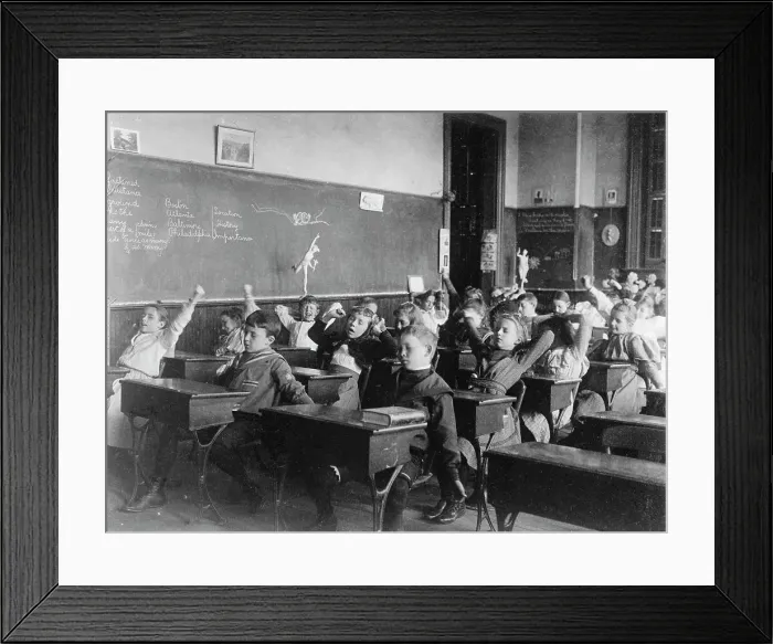 Framed Print : Children seated at desks in Washington, D.C. classroom, stretching, (1899?). Creator: Frances Benjamin Johnston Framed Print : Children seated at desks in Washington, D.C. classroom, stretching, (1899?). Creator: Frances Benjamin Johnston