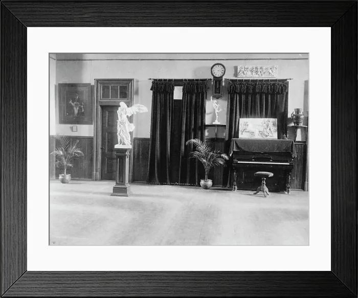 Framed Print : Room with piano, potted palms, and classical statues and friezes, (1899?). Creator: Frances Benjamin Johnston Framed Print : Room with piano, potted palms, and classical statues and friezes, (1899?). Creator: Frances Benjamin Johnston