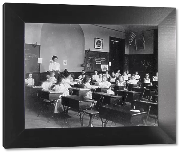 Young girls seated at desks in Washington, D.C. classroom, (1899?). Creator: Frances Benjamin Johnston