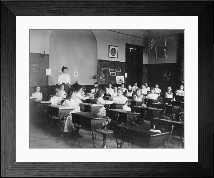 Framed Print : Young girls seated at desks in Washington, D.C. classroom, (1899?). Creator: Frances Benjamin Johnston