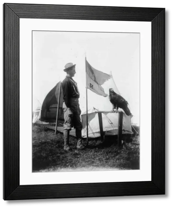 Framed Print : Soldier and eagle mascot beside H Troop flag, 1898. Creator: Frances Benjamin Johnston. Soldier and eagle mascot beside H Troop flag, 1898. Creator: Frances Benjamin Johnston Framed Print : Soldier and eagle mascot beside H Troop flag, 1898. Creator: Frances Benjamin Johnston. Soldier and eagle mascot beside H Troop flag, 1898. Creator: Frances Benjamin Johnston