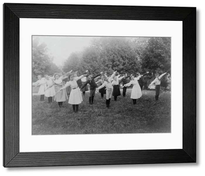 Framed Print : School children exercising on lawn, Washington, D.C. (1899?). Creator: Frances Benjamin Johnston Framed Print : School children exercising on lawn, Washington, D.C. (1899?). Creator: Frances Benjamin Johnston
