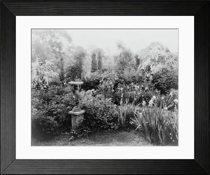 Framed Print : English lead figurine holding sundial, Graham Nichols garden, Greenwich, Connecticut, c1908 - 1927. Creator: Frances Benjamin Johnston Framed Print : English lead figurine holding sundial, Graham Nichols garden, Greenwich, Connecticut, c1908 - 1927. Creator: Frances Benjamin Johnston