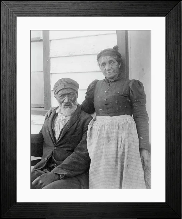 Framed Print : Elderly African American couple posed outside of building, near Hampton Institute... 1899 or 1900. Creator: Frances Benjamin Johnston Framed Print : Elderly African American couple posed outside of building, near Hampton Institute... 1899 or 1900. Creator: Frances Benjamin Johnston