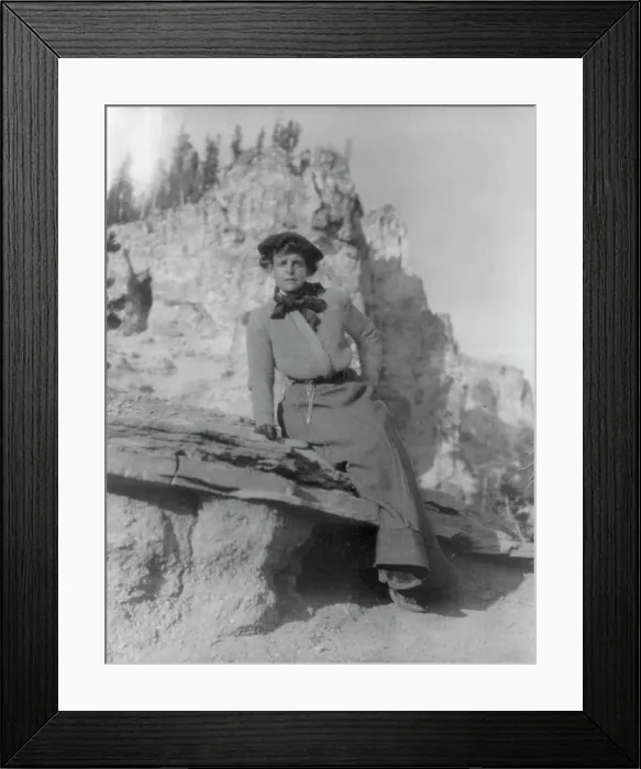 Framed Print : Frances Benjamin Johnston, full-length portrait, sitting on ledge with... between 1888 and 1920. Creator: Frances Benjamin Johnston Framed Print : Frances Benjamin Johnston, full-length portrait, sitting on ledge with... between 1888 and 1920. Creator: Frances Benjamin Johnston