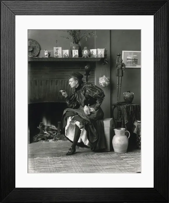Framed Print : Frances Benjamin Johnston, full-length portrait, seated in front of fireplace, facing left... 1896. Creator: Frances Benjamin Johnston Framed Print : Frances Benjamin Johnston, full-length portrait, seated in front of fireplace, facing left... 1896. Creator: Frances Benjamin Johnston