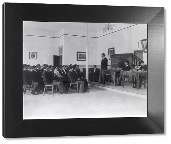 Men debating in class, Carlisle Indian School, Carlisle, Pennsylvania, 1901. Creator: Frances Benjamin Johnston