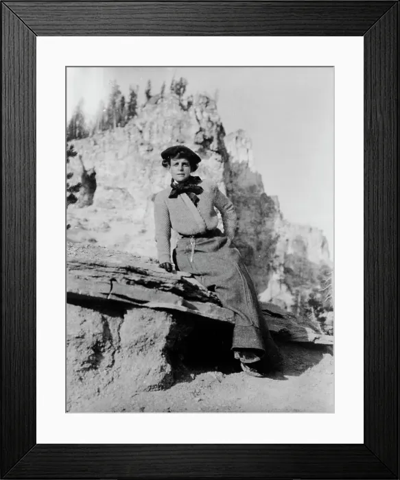 Framed Print : Frances Benjamin Johnston, full-length portrait, seated on rock in Yellowstone National Park, 1903. Creator: Frances Benjamin Johnston Framed Print : Frances Benjamin Johnston, full-length portrait, seated on rock in Yellowstone National Park, 1903. Creator: Frances Benjamin Johnston
