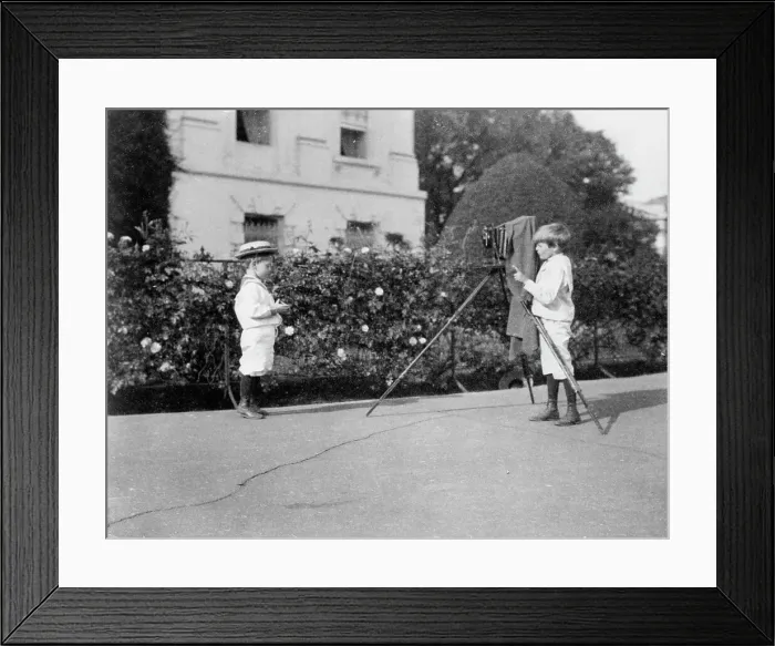 Framed Print : Archie Roosevelt photographing Quentin Roosevelt outdoors, 1902. Creator: Frances Benjamin Johnston Framed Print : Archie Roosevelt photographing Quentin Roosevelt outdoors, 1902. Creator: Frances Benjamin Johnston