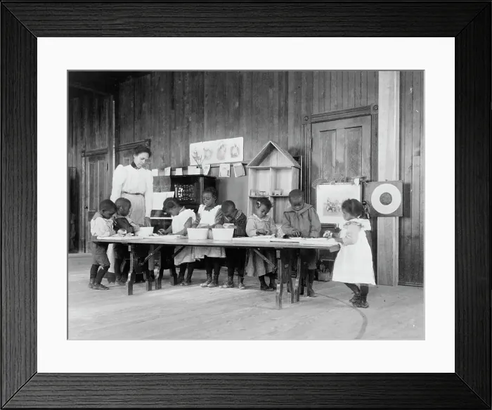 Framed Print : Eight African American children, in kindergarten, learning washing and ironing... 1899 or 1900. Creator: Frances Benjamin Johnston Framed Print : Eight African American children, in kindergarten, learning washing and ironing... 1899 or 1900. Creator: Frances Benjamin Johnston