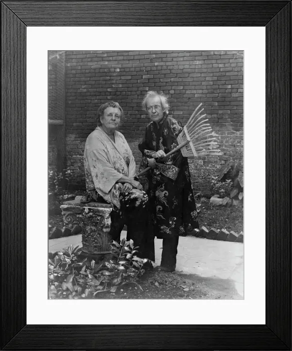 Framed Print : Frances B. Johnston in garden in New Orleans with Pops Whitesell, who is holding... c1945 - 1952. Creator: Frances Benjamin Johnston. Frances B. Johnston in garden in New Orleans with Pops Whitesell, who is holding... c1945 - 1952 Framed Print : Frances B. Johnston in garden in New Orleans with Pops Whitesell, who is holding... c1945 - 1952. Creator: Frances Benjamin Johnston. Frances B. Johnston in garden in New Orleans with Pops Whitesell, who is holding... c1945 - 1952