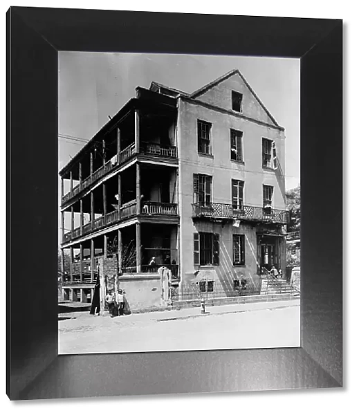 Front and side view of apartment(?) house, 61 Washington Street, Charleston, South... c1933 - 1940. Creator: Frances Benjamin Johnston