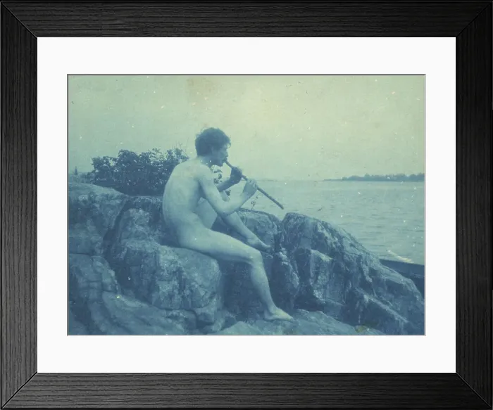 Framed Print : Man posed on rocks, nude, playing pipe (Pan), between 1885 and 1900. Creator: Frances Benjamin Johnston Framed Print : Man posed on rocks, nude, playing pipe (Pan), between 1885 and 1900. Creator: Frances Benjamin Johnston