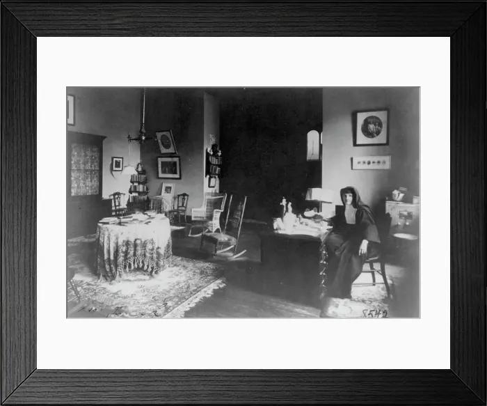 Framed Print : Georgetown Convent, Washington, D.C. - nun seated at desk in furnished room, not after 1892. Creator: Frances Benjamin Johnston Framed Print : Georgetown Convent, Washington, D.C. - nun seated at desk in furnished room, not after 1892. Creator: Frances Benjamin Johnston