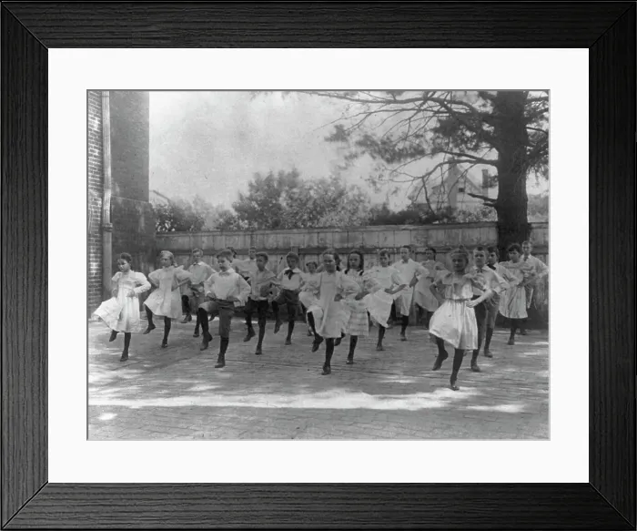 Framed Print : School children learning a dance in a school yard, Washington, D.C. (1899?). Creator: Frances Benjamin Johnston Framed Print : School children learning a dance in a school yard, Washington, D.C. (1899?). Creator: Frances Benjamin Johnston