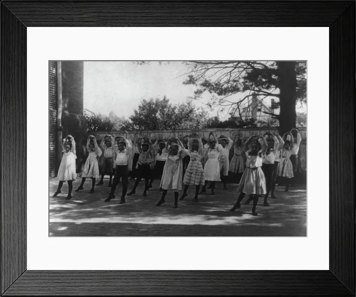Framed Print : School children learning a dance in a school yard, Washington, D.C. (1899?). Creator: Frances Benjamin Johnston Framed Print : School children learning a dance in a school yard, Washington, D.C. (1899?). Creator: Frances Benjamin Johnston