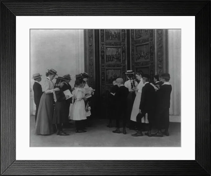 Framed Print : Washington, D.C. school children on field trip - examining the bronze Columbus door... (1899?). Creator: Frances Benjamin Johnston. Washington, D.C. school children on field trip - examining the bronze Columbus door... (1899?) Framed Print : Washington, D.C. school children on field trip - examining the bronze Columbus door... (1899?). Creator: Frances Benjamin Johnston. Washington, D.C. school children on field trip - examining the bronze Columbus door... (1899?)