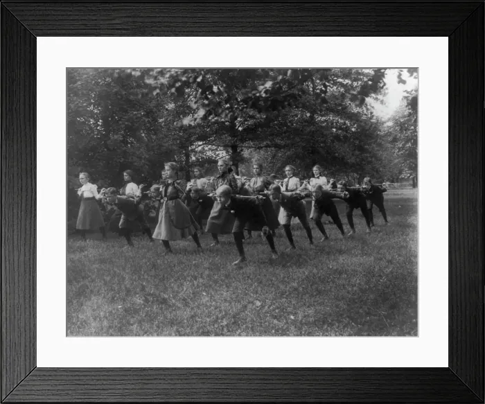 Framed Print : Classroom scenes in Washington, D.C. public schools - outdoor exercise with rods... (1899?). Creator: Frances Benjamin Johnston Framed Print : Classroom scenes in Washington, D.C. public schools - outdoor exercise with rods... (1899?). Creator: Frances Benjamin Johnston