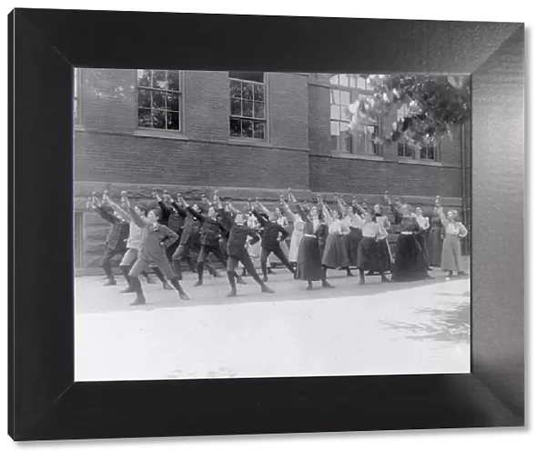 First Division school class exercising with barbells in schoolyard, Washington, D.C. (1899?). Creator: Frances Benjamin Johnston