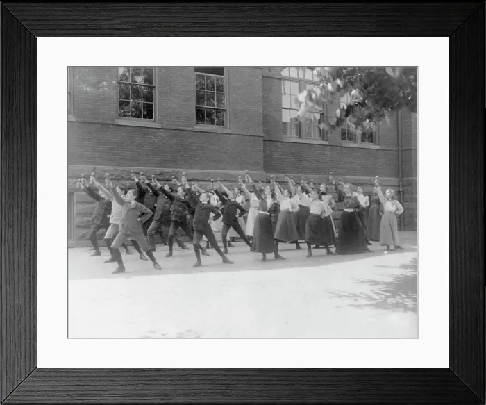 Framed Print : First Division school class exercising with barbells in schoolyard, Washington, D.C. (1899?). Creator: Frances Benjamin Johnston Framed Print : First Division school class exercising with barbells in schoolyard, Washington, D.C. (1899?). Creator: Frances Benjamin Johnston