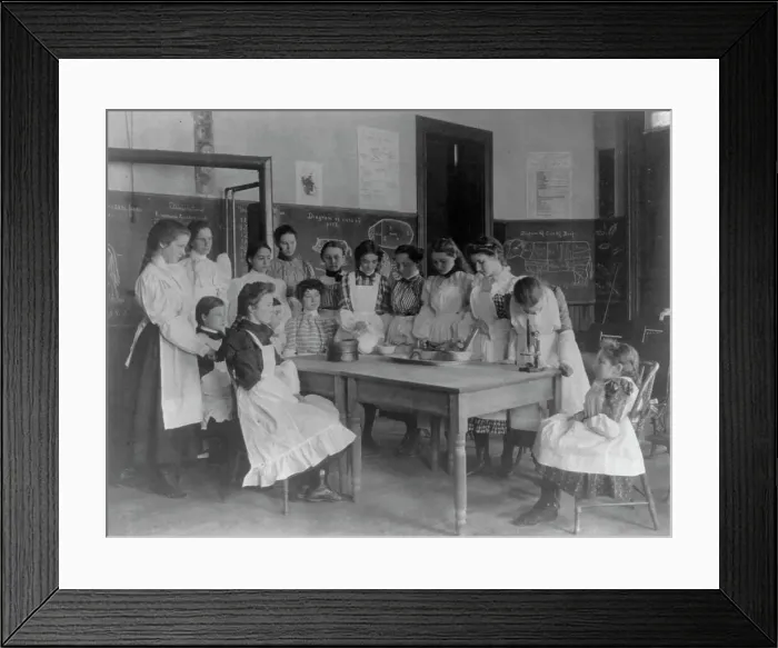 Framed Print : Girls posed in home economics class, 1st Division, Washington, D.C. (1899?). Creator: Frances Benjamin Johnston